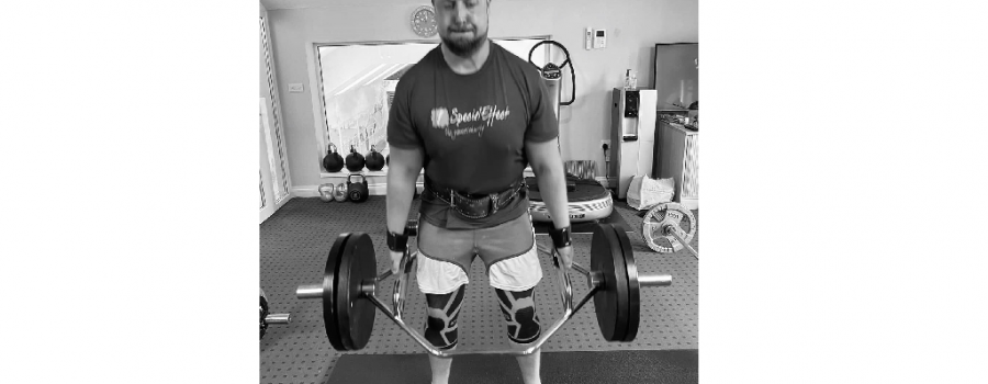 Adam Forder lifting weights for SpecialEffect